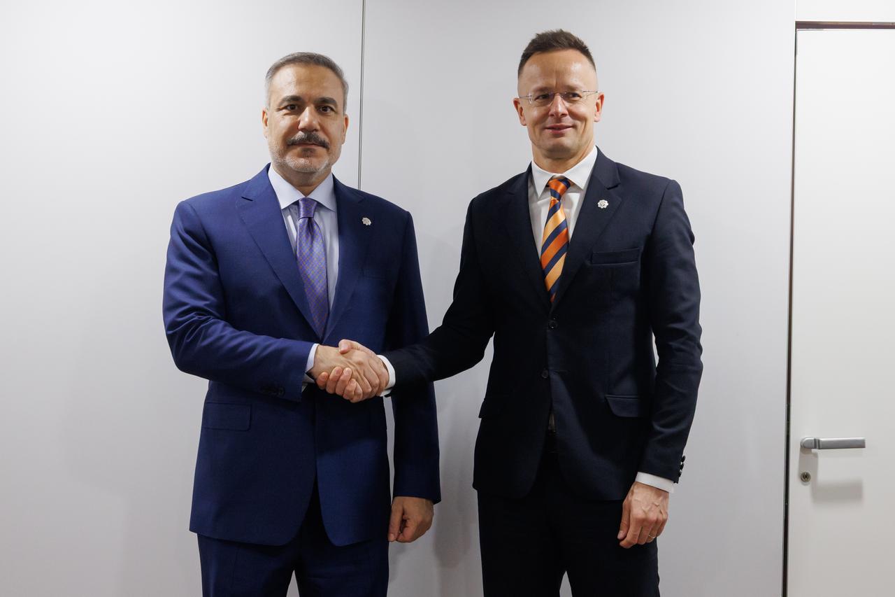 Turkish Foreign Minister Hakan Fidan (L) meets with Hungarian Foreign Minister Peter Szijjarto (R) within his visit for 32nd Ministerial Council Meeting of the Organization for Security and Cooperation in Europe (OSCE) in Vienna, Austria, December 4, 2025. (AA Photo)