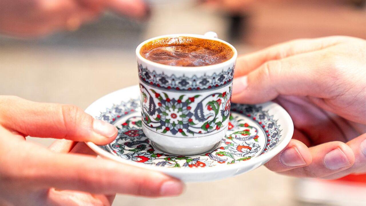 The image shows two people holding a cup of traditional Turkish coffee, which is a unique brewing method where finely ground coffee is boiled in a pot called a cezve. (Photo via X)