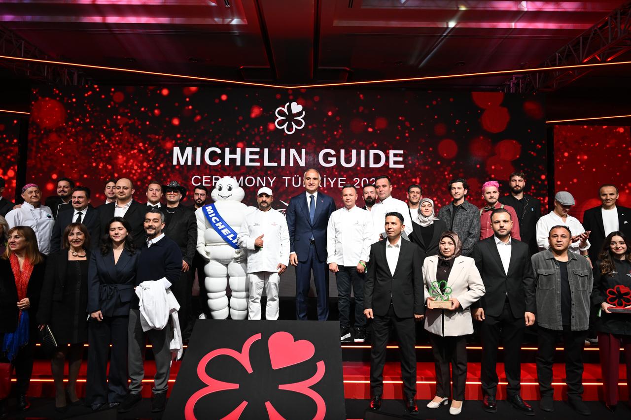 Culture and Tourism Minister Mehmet Nuri Ersoy (C) and chefs, award recipients and officials gather on stage during the Michelin Guide Türkiye 2026 ceremony in Istanbul, Türkiye. (AA Photo)
