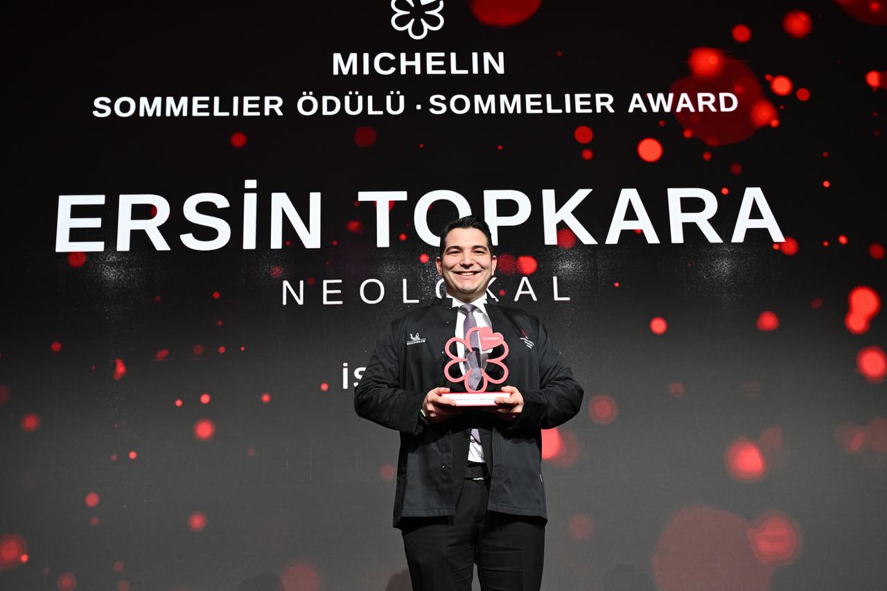 Ersin Topkara of Neolokal poses with his Sommelier Award during the Michelin Guide Türkiye 2026 ceremony. (AA Photo)