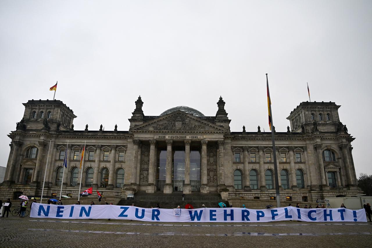 Activists hold a banner reading "No to conscription!" German MP's are voting on a controversial pension package and a new military service plan. Berlin, Germany, December 5, 2025. (AFP Photo)