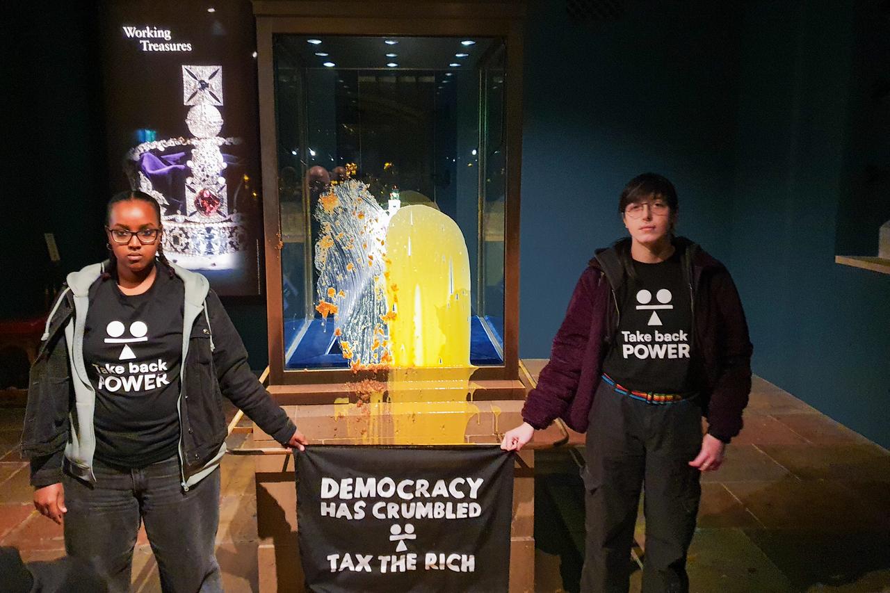 UK activists throw custard at royal crown display in London Tower protest