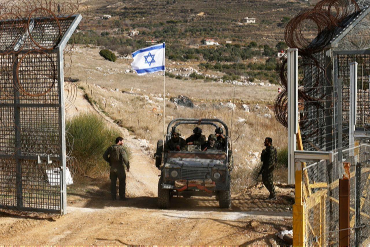 An Israeli military vehicle crosses the fence as they return from buffer zone with Syria, near Druze village of Majdal Shams in Israel-annexed Golan Heights, Dec. 10, 2024. (AFP Photo)