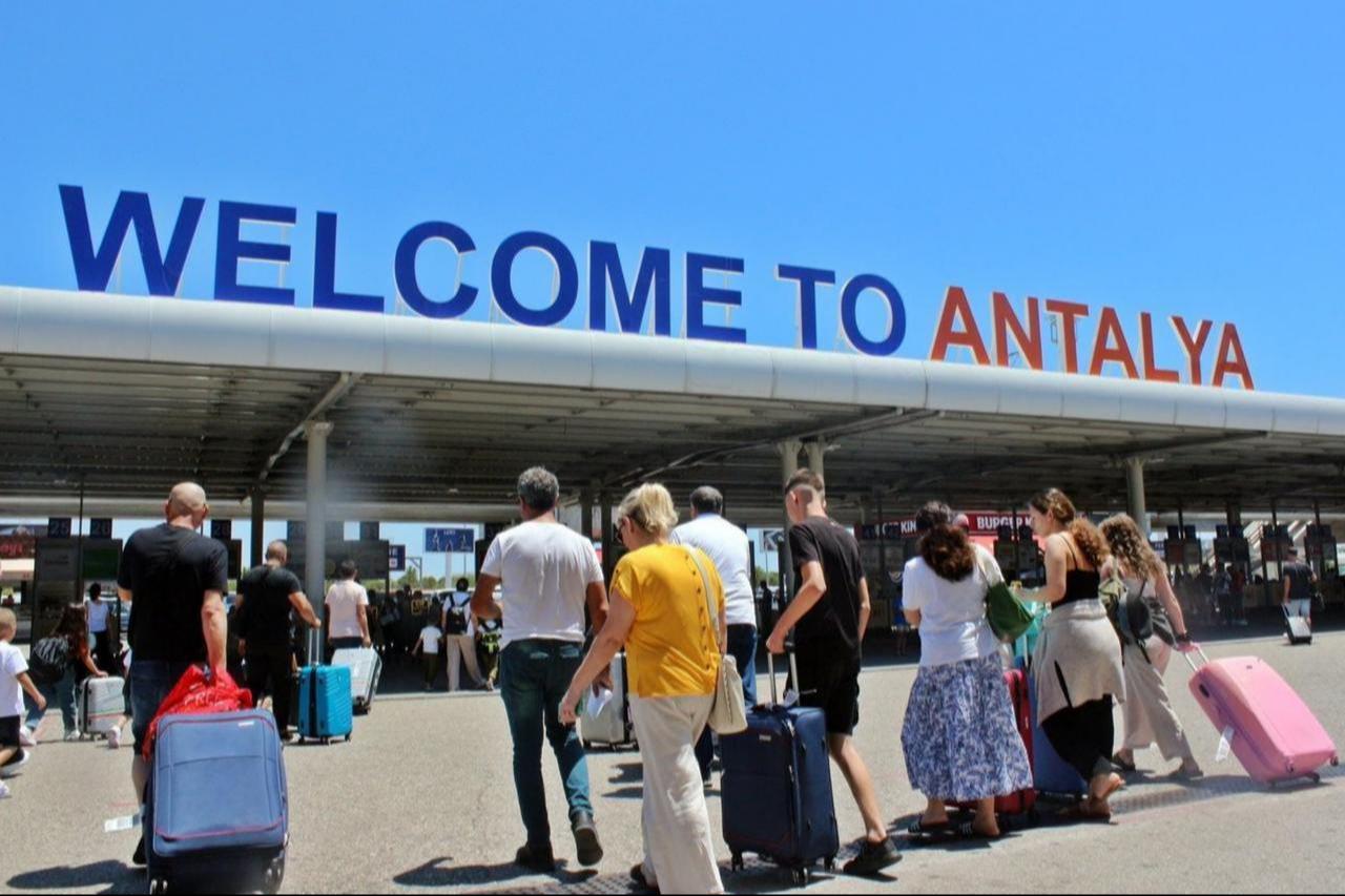 Tourists arrive at Antalya Airport, a gateway to Türkiyes premier travel destination, in southern Türkiye, Dec. 6, 2023. (IHA Photo)