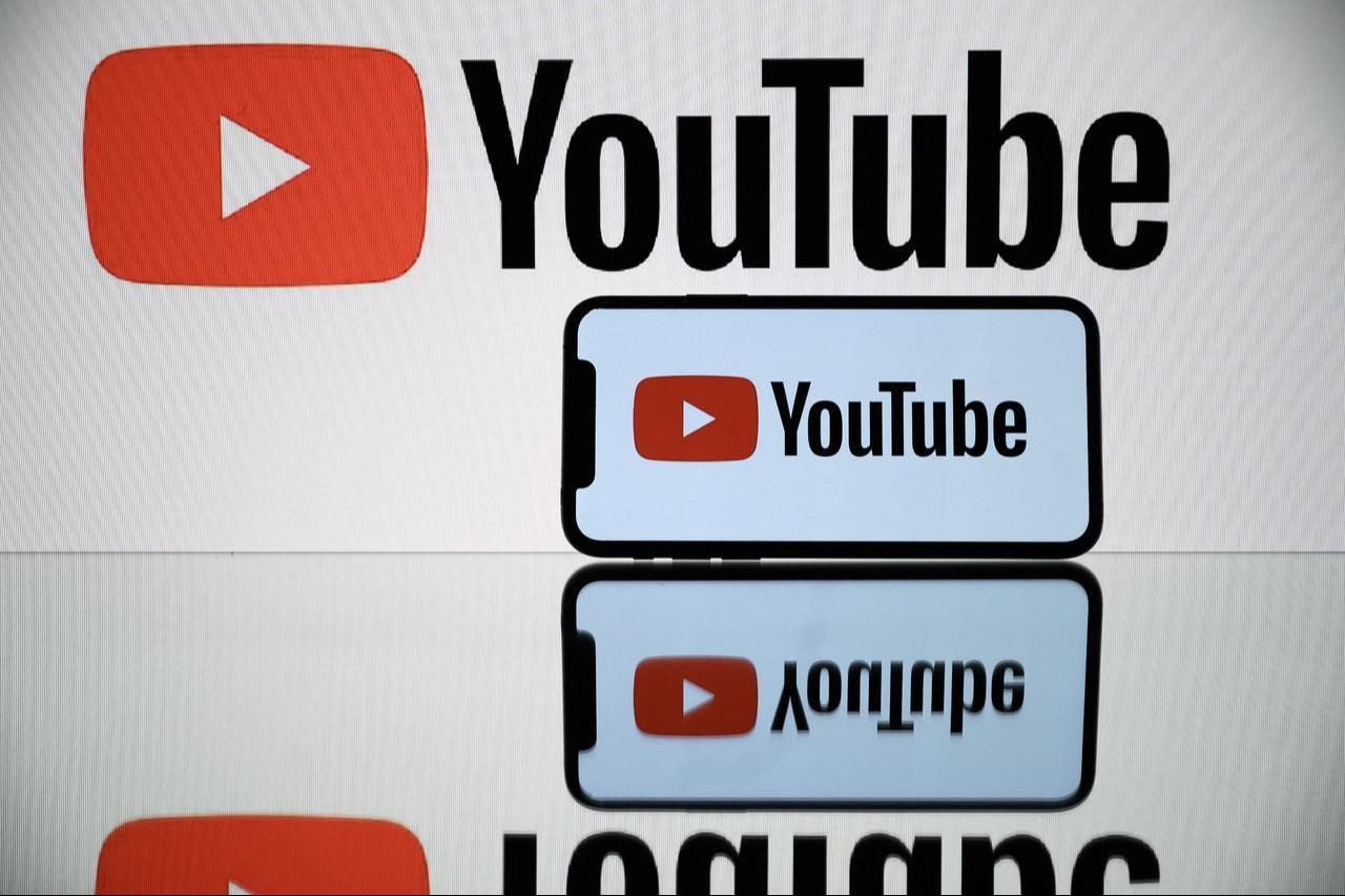 Photo illustration shows the YouTube logo displayed on a tablet and a smartphone, October 5, 2021. (AFP Photo)