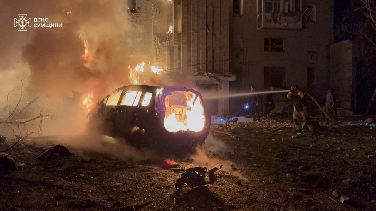 This handout picture, taken and released by the Ukrainian State Emergency Service on December 8, 2025 shows firefighters working to extinguish a fire following a drone attack to a residential building in Okhtyrka, Sumy region. (AFP Photo)