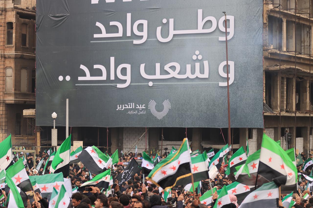 Syrian people gather to celebrate the first anniversary of the fall of Bashar al-Assad's regime in Aleppo, Syria on December 08, 2025. (AA Photo)