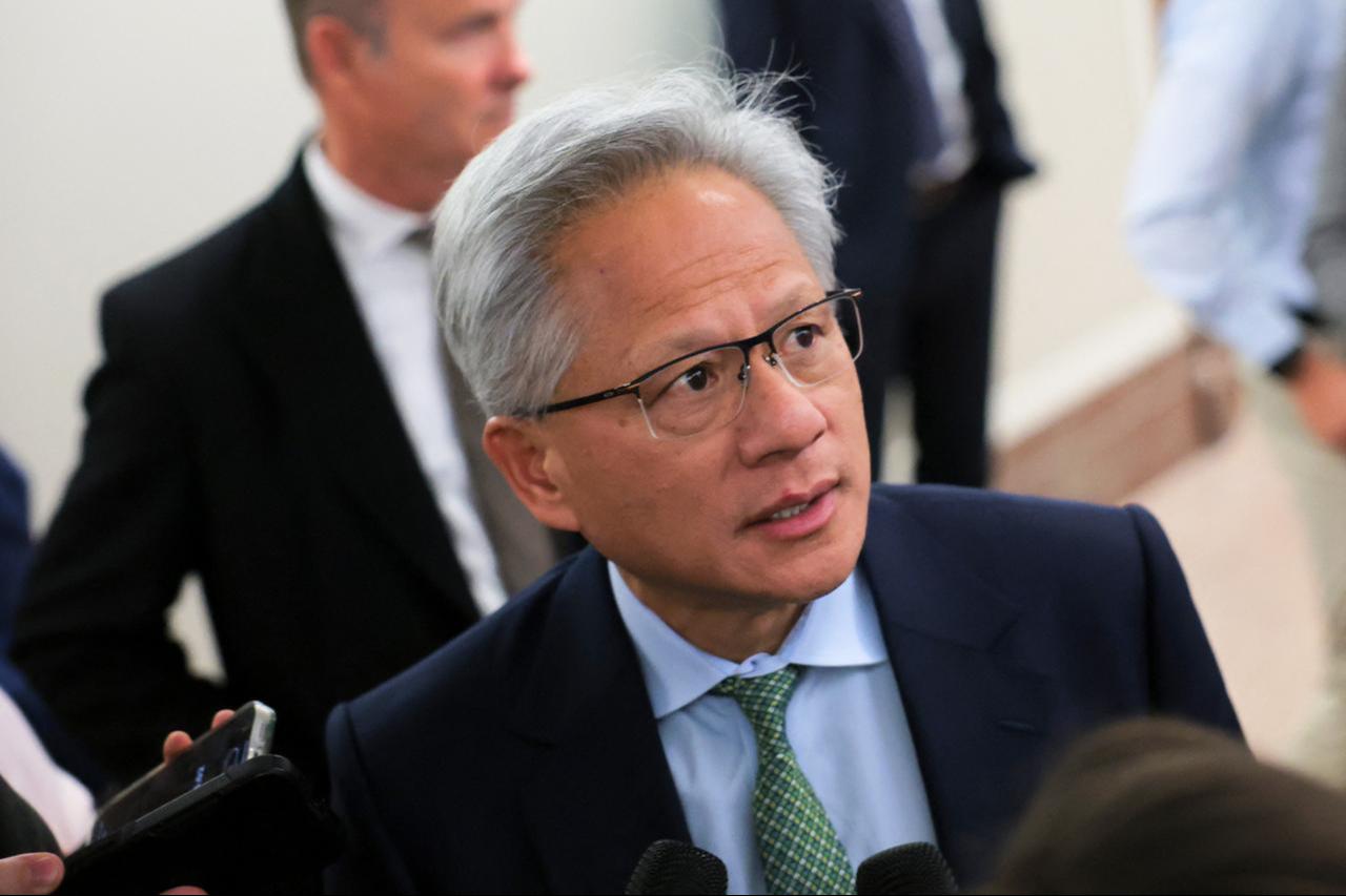 Nvidia President and CEO Jensen Huang speaks to the media as he arrives for a meeting with the Senate Banking Committee on Capitol Hill in Washington, DC, December 3, 2025. (AFP Photo)