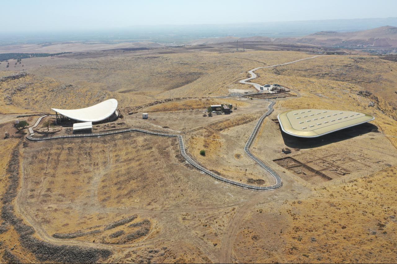 Gobeklitepe’s twin excavation shelters seen from above — the white-roofed structure (left) marks the first excavation area (GT1), while the green-roofed complex (right) covers the second site (GT2), which is preparing to open to visitors in Sanliurfa, Türkiye, Oct. 23, 2025. (AA Photo)