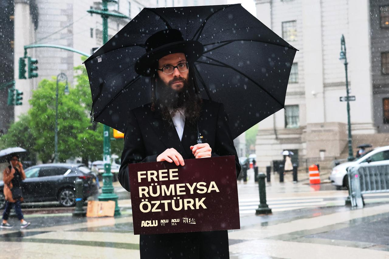 (FILES) People gather for a rally in support of Turkish student Rumeysa Ozturk (in photo) and Columbia University student activist Mohsen Mahdawi in Foley Square on May 6, 2025 in New York City. US Judge William Sessions on May 9, 2025, ordered the release of Turkish student Rumeysa Ozturk, a Ph.D student at Tufts University in Massachusetts, detained by federal agents as part of President Donald Trumps crackdown on pro-Palestinian campus activism. (Photo by Michael M. Santiago / GETTY IMAGES NORTH AMERICA / AFP)