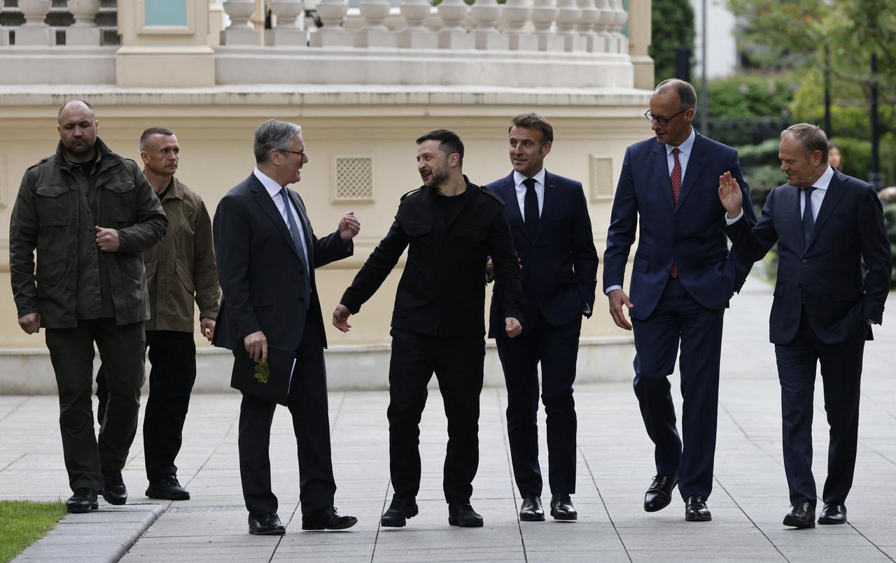 In this handout photograph taken and released by the Ukrainian Presidential Press Service on May 10, 2025, Ukraines President Volodymyr Zelensky (2nd R) attends a meeting with Britains Prime Minister Keir Starmer (L), Frances President Emmanuel Macron (2nd L), Polands Prime Minister Donald Tusk (R) and Germanys Chancellor Friedrich Merz (3rd R) in Kyiv, amid the Russian invasion of Ukraine. (Photo by Handout / UKRAINIAN PRESIDENTIAL PRESS SERVICE / AFP) / RESTRICTED TO EDITORIAL USE - MANDATORY CREDIT  AFP PHOTO / UKRAINIAN PRESIDENTIAL PRESS SERVICE  - NO MARKETING NO ADVERTISING CAMPAIGNS - DISTRIBUTED AS A SERVICE TO CLIENTS