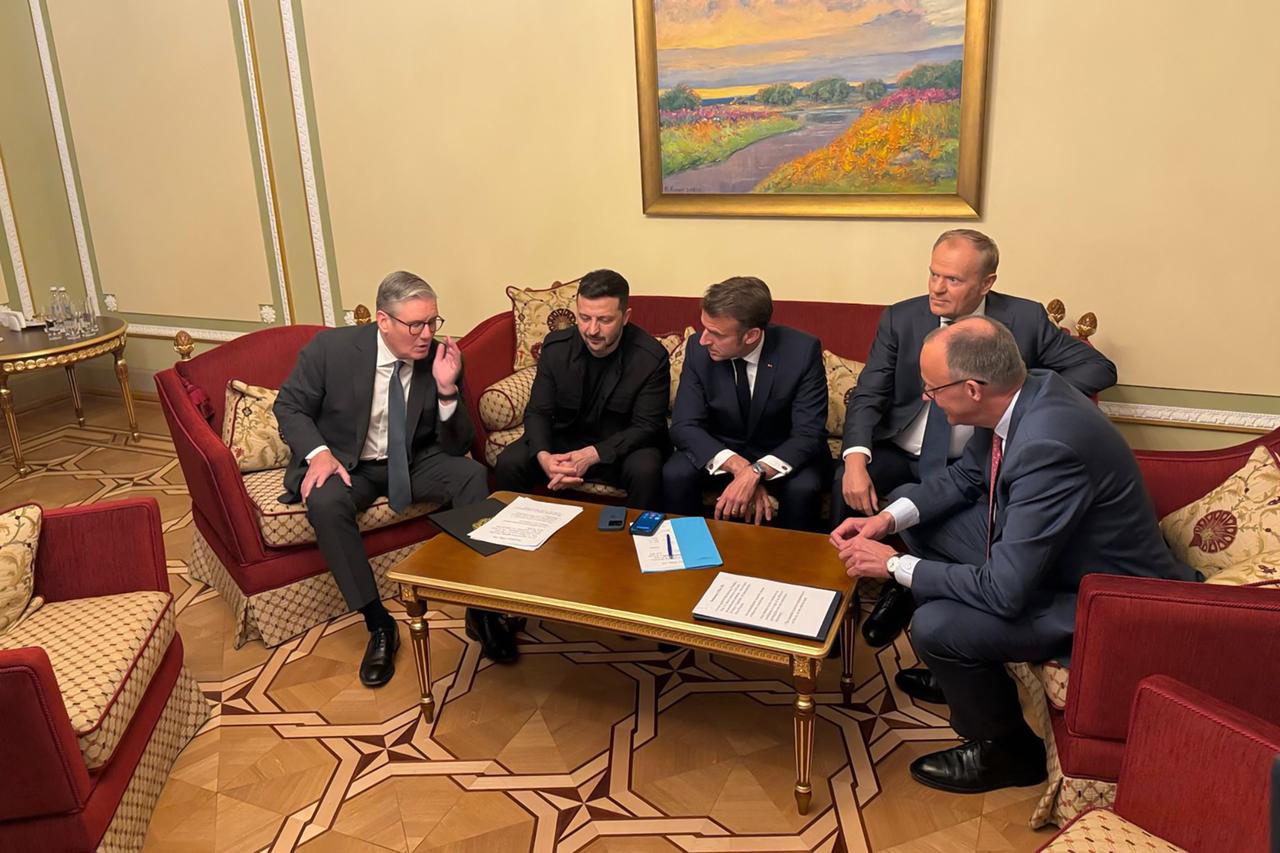 In this handout photograph taken and released by the Ukrainian Presidential Press Service on May 10, 2025, Ukraines President Volodymyr Zelensky (2nd R) attends a meeting with Britains Prime Minister Keir Starmer (L), Frances President Emmanuel Macron (2nd L), Polands Prime Minister Donald Tusk (R) and Germanys Chancellor Friedrich Merz (3rd R) in Kyiv, amid the Russian invasion of Ukraine. (Photo by Handout / UKRAINIAN PRESIDENTIAL PRESS SERVICE / AFP) / RESTRICTED TO EDITORIAL USE - MANDATORY CREDIT  AFP PHOTO / UKRAINIAN PRESIDENTIAL PRESS SERVICE  - NO MARKETING NO ADVERTISING CAMPAIGNS - DISTRIBUTED AS A SERVICE TO CLIENTS