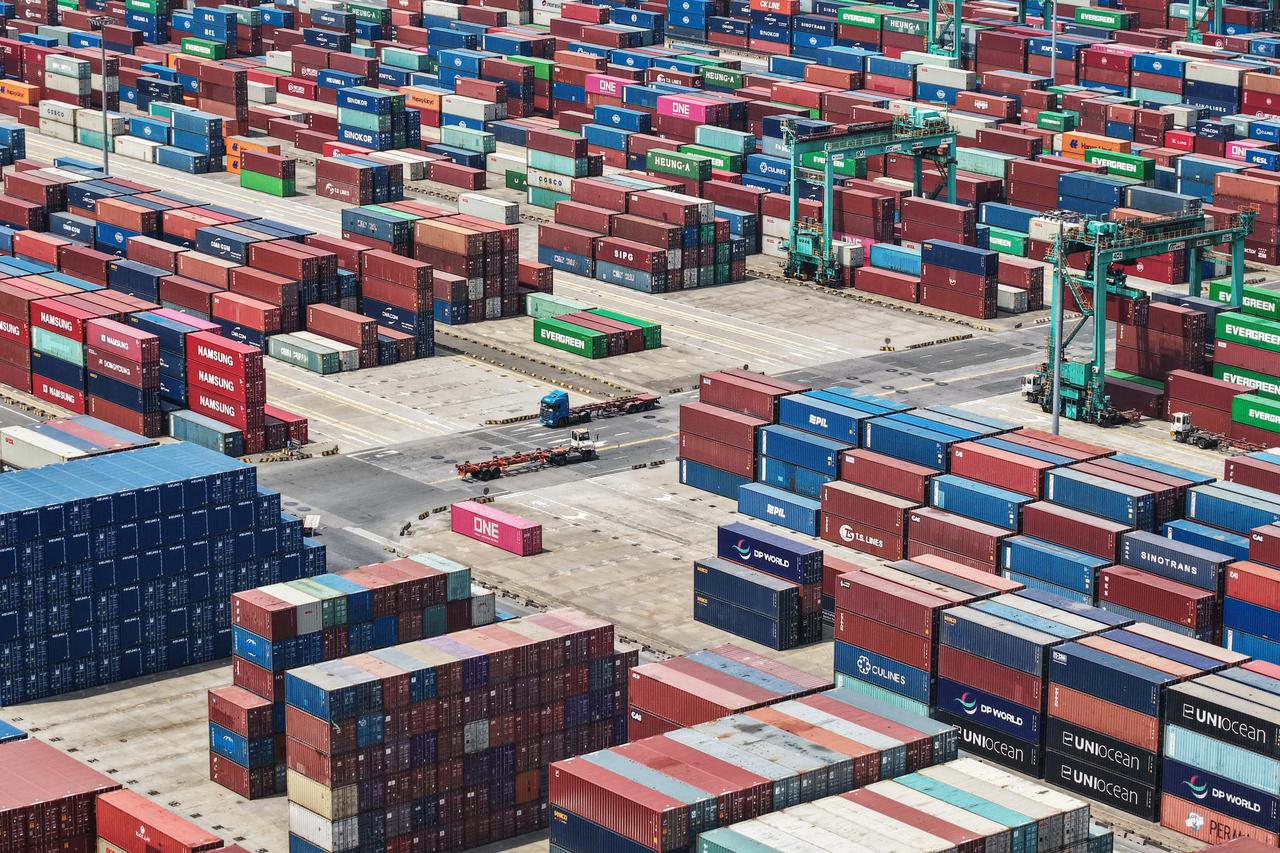 Shipping containers are stacked at a port in Shanghai on May 9, 2025. (AFP Photo)