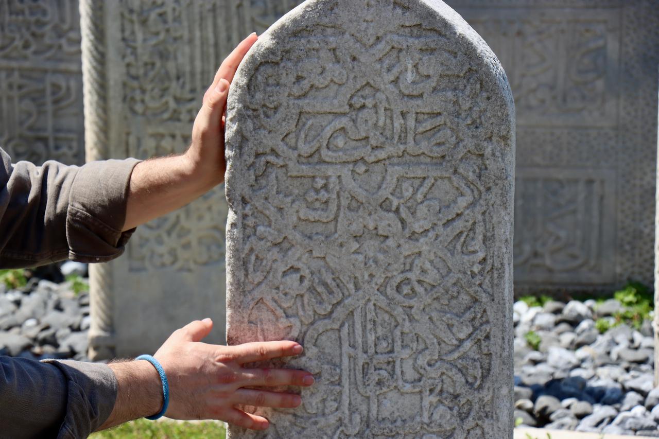 The preserved tombstone of Sinan Bey, the court painter known as "Nakkas" from the era of Ottoman Sultan Mehmed II, remains from his long-lost grave in Bursa, Türkiye, May 12, 2025. (AA Photo)