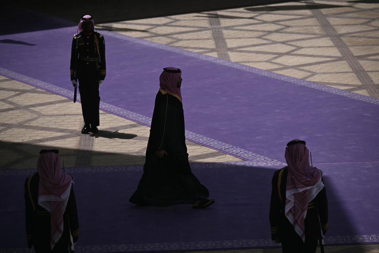 This picture shows a poster depicting King Abdulaziz bin Saud (top), the founder of the modern Kingdom of Saudi Arabia, King Salman bin Abdulaziz (R), and Crown Prince Mohammed bin Salman (L) in Riyadh on May 12, 2025. (Photo by Giuseppe CACACE / AFP)