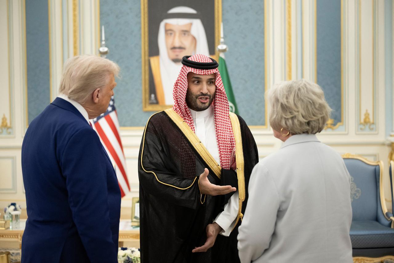 This picture shows a poster depicting King Abdulaziz bin Saud (top), the founder of the modern Kingdom of Saudi Arabia, King Salman bin Abdulaziz (R), and Crown Prince Mohammed bin Salman (L) in Riyadh on May 12, 2025. (Photo by Giuseppe CACACE / AFP)