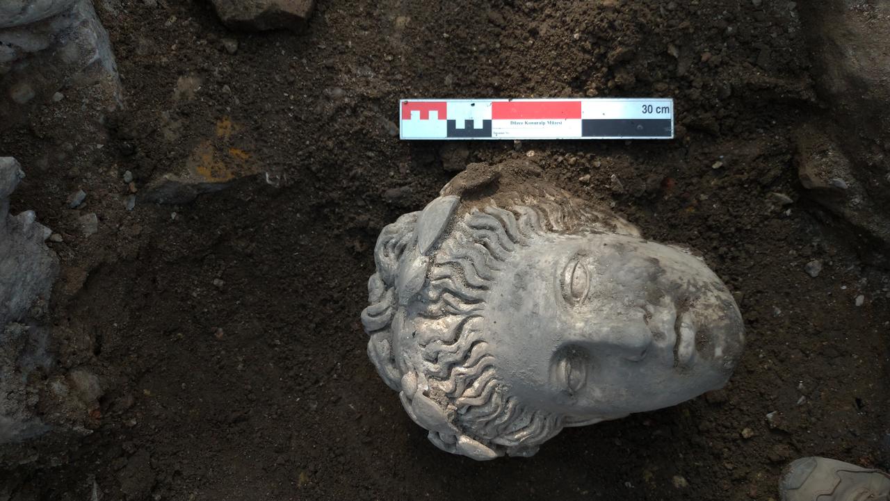 The head of the Apollo statue emerges after being hidden underground for nearly 1,500 years, in ancient city of Prusias ad Hypium, Duzce, Türkiye, August 17, 2022. (Photo via Koray Erdogan/Türkiye Today)
