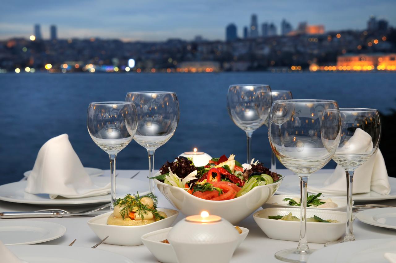 A table set for dinner at a waterfront restaurant in Istanbul, Türkiye, accessed on May 13, 2025. (Adobe Stock Photo)