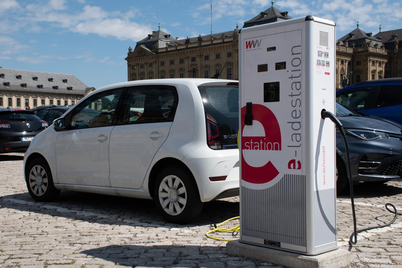 A Volkswagen e-Up charges at a WVV e-ladestation in front of the historic Würzburg Residence in Germany, on August 14, 2021. (Adobe Stock Photo)