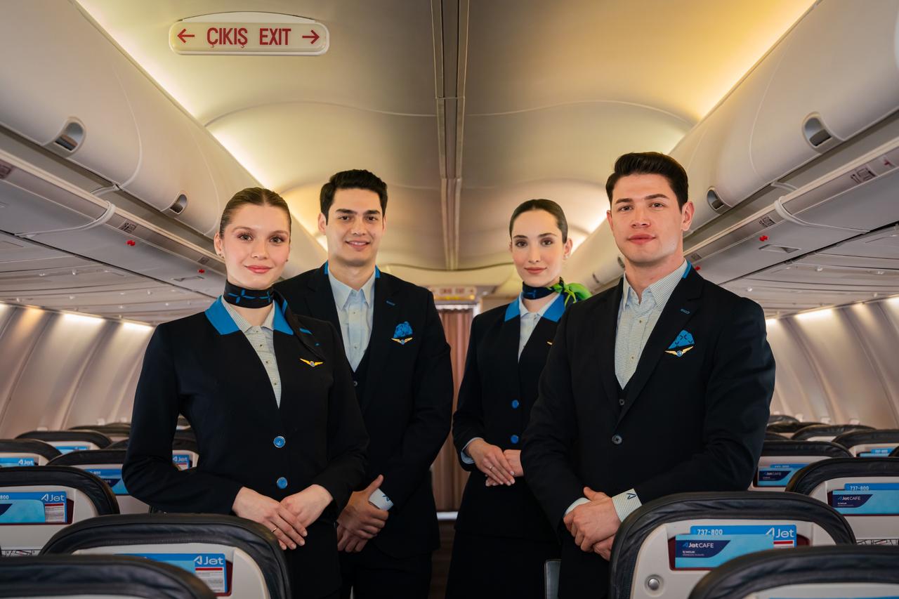 Promotional photo shows AJet cabin crew members posing inside the aircraft, accessed on May 14, 2025. (Courtesy of AJet)