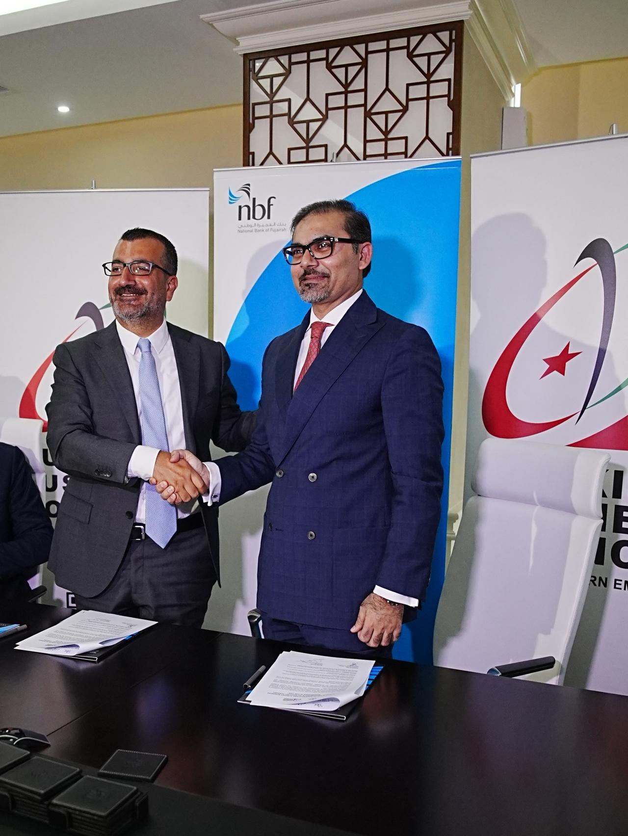 CEO of the National Bank of Fujairah Adnan Anwar (right) and President of the Turkish Business Council of Dubai and the Northern Emirates Kanat Kutluk (left) attend the signing of a strategic agreement in Dubai on May 13, 2025. (AA Photo)