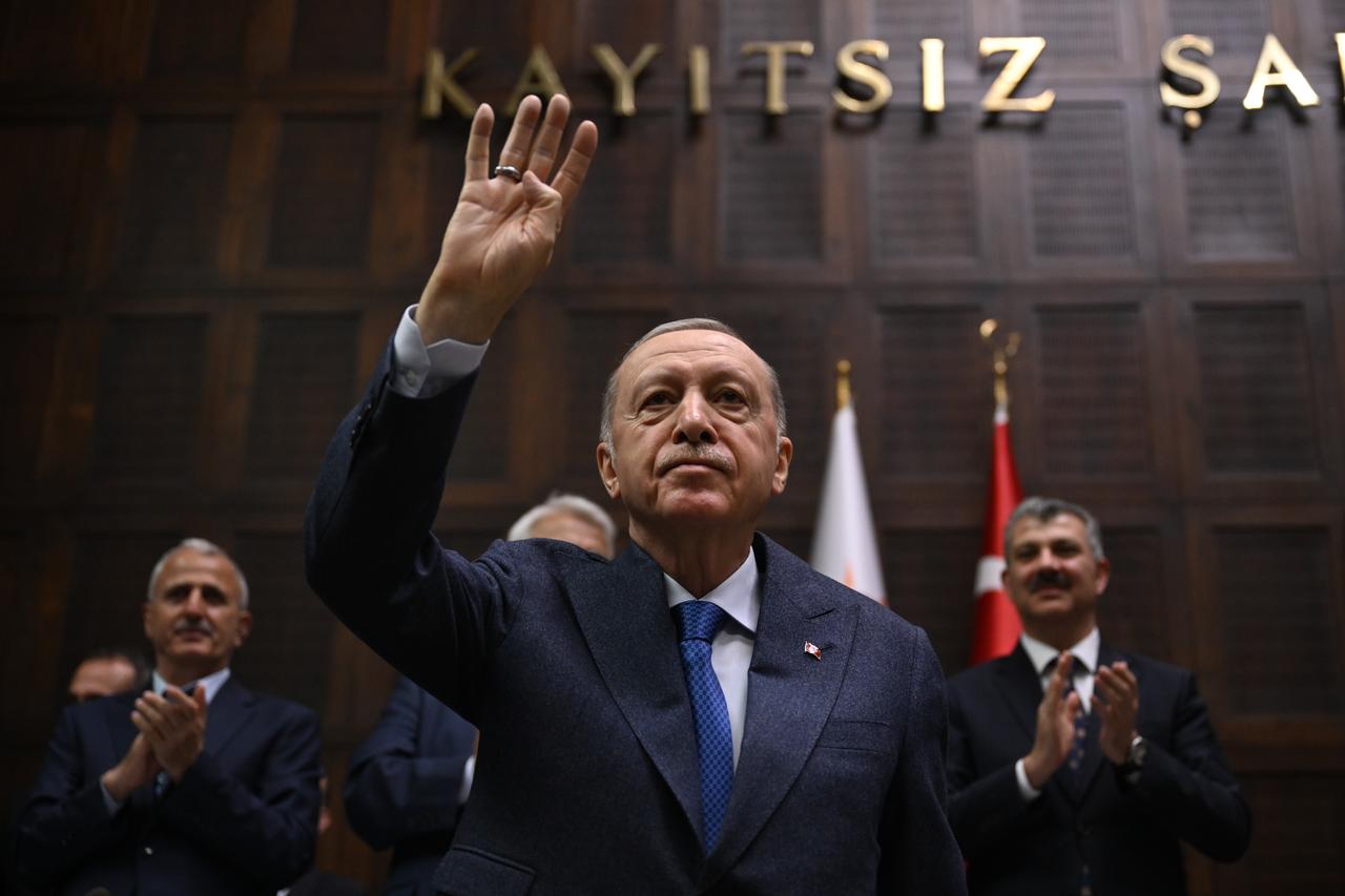 Turkish President and Leader of the Justice and Development (AK) Party Recep Tayyip Erdogan greets people as he attends the partys group meeting at the Turkish Grand National Assembly in Ankara, Turkiye on May 14, 2025. (AA Photo)