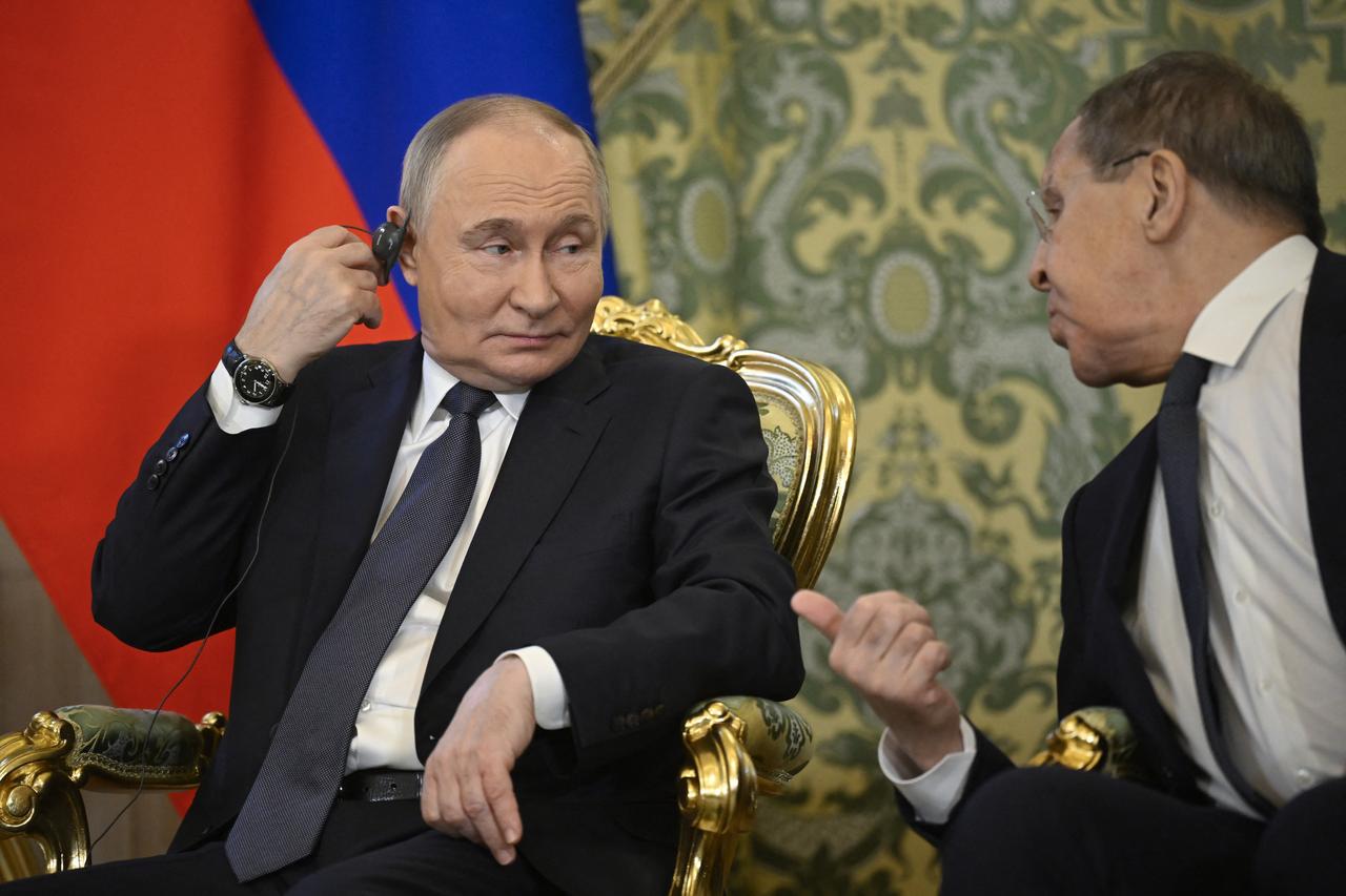 Russian President Vladimir Putin listens to Foreign Minister Sergei Lavrov during a meeting with Malaysias Prime Minister at the Kremlin in Moscow on May 14, 2025. (AFP Photo)
