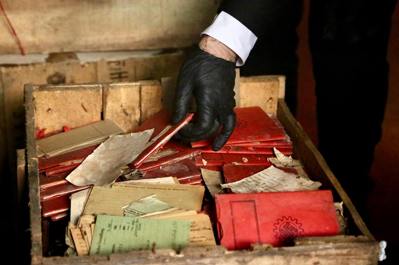 Documents recovered from wooden crates in the basement of Argentina's Supreme Court included Nazi notebooks, photographs, and postcards. (AFP Photo)