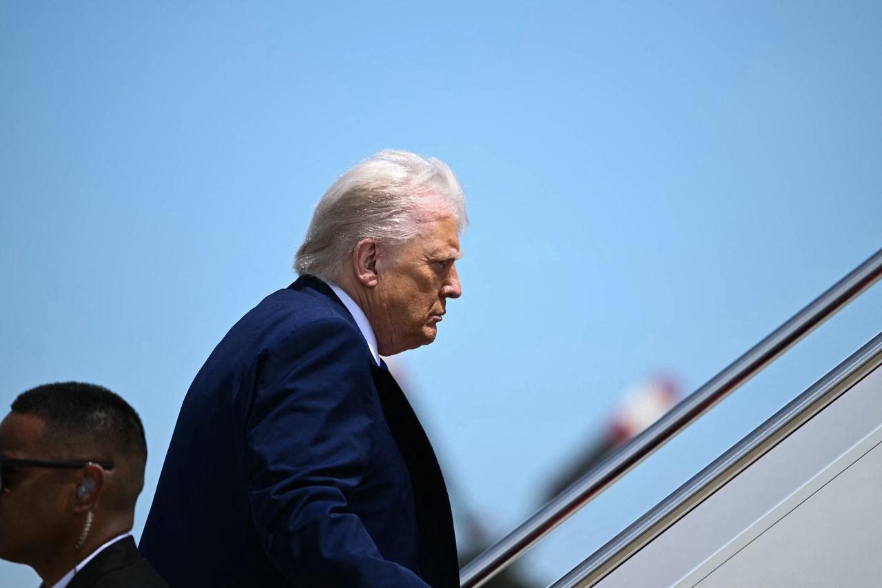 US President Donald Trump boards Air Force One at Joint Base Andrews in Maryland on May 12, 2025. President Trump is travelling to the Middle East, where Saudi Arabia will be the first stop on a four-day trip. (Photo by Brendan SMIALOWSKI / AFP)