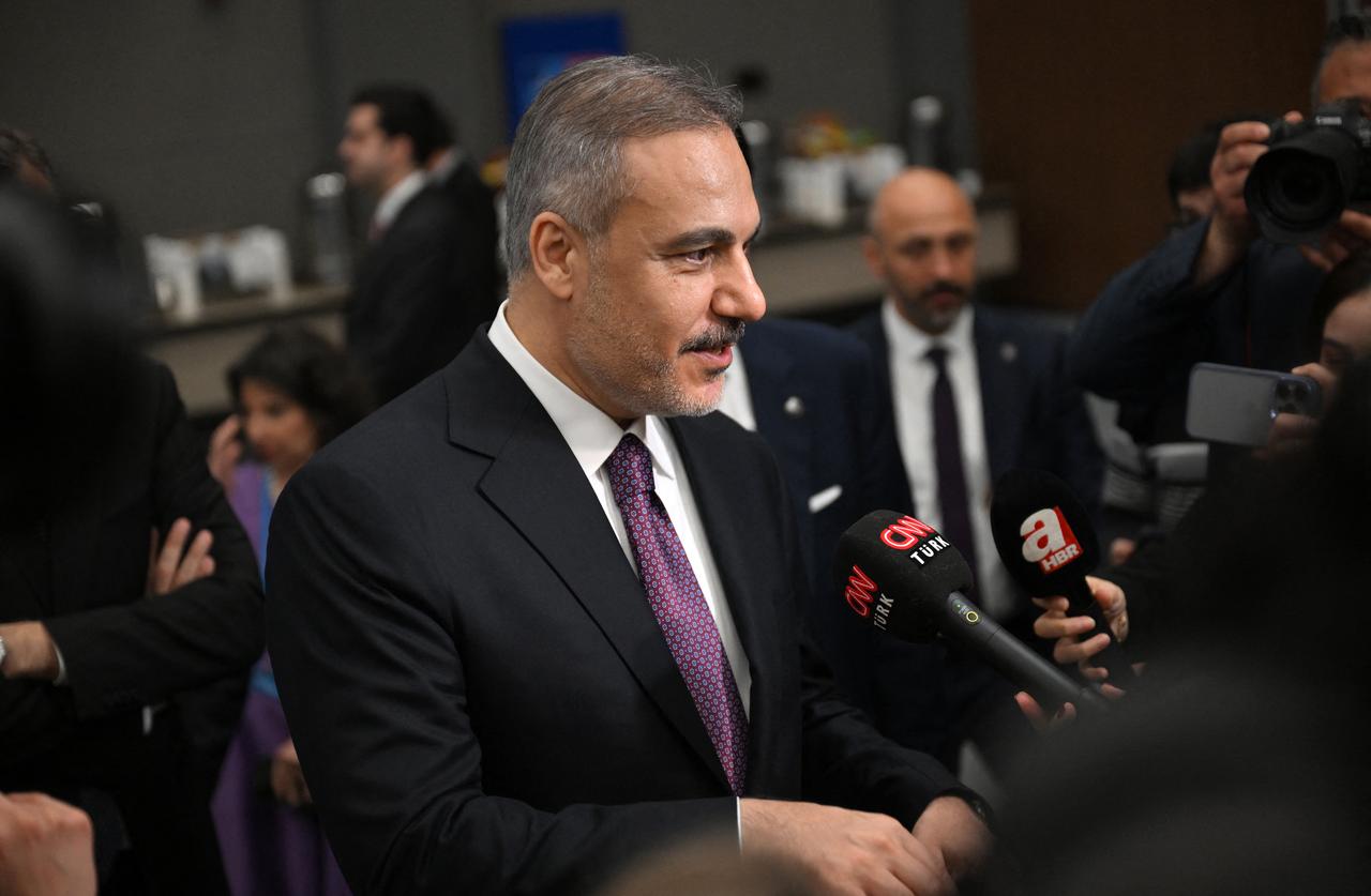 Turkish Foreign Minister Hakan Fidan talks to journalists as he visits the media centre on the sidelines of an informal meeting of NATO Ministers of Foreign Affairs, at the NEST Convention Center in Antalya on May 14, 2025. (AFP Photo)