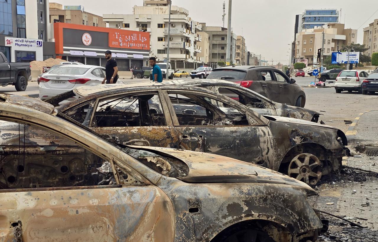 A general view of the burned cars in clashes between Libyan security forces and the militia group called “Stability Support Apparatus” following the start of the ceasefire in Libyan capital Tripoli on May 14, 2025. (AA Photo)