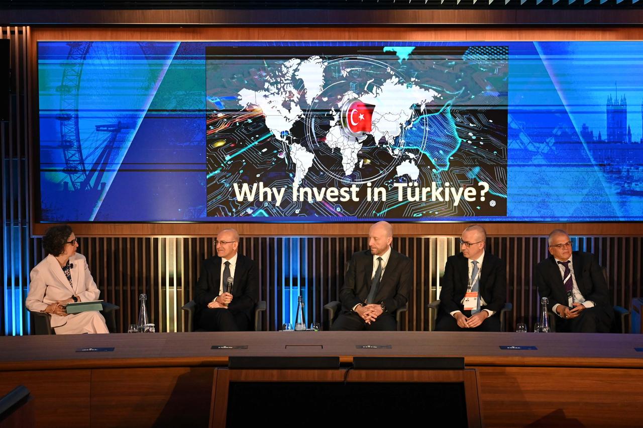 Turkish Treasury and Finance Minister Mehmet Simsek delivers a presentation on the Turkish economy and answers questions during the session titled "Turkiye’s Economic Transformation and Growing Investment Potential" held as part of the European Bank for Reconstruction and Development (EBRD) Annual Meetings in London, United Kingdom, on May 14, 2025. (AA Photo)