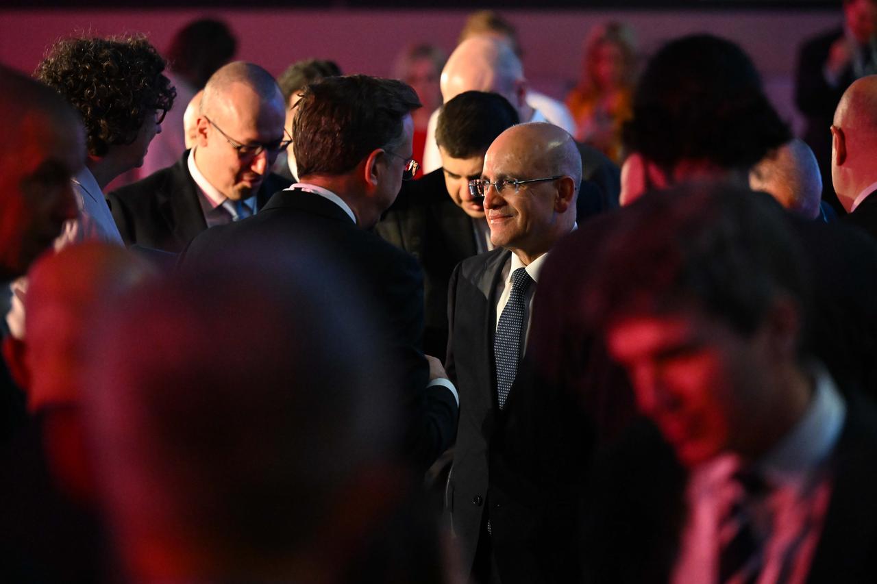 Turkish Treasury and Finance Minister Mehmet Simsek delivers a presentation on the Turkish economy and answers questions during the session titled "Turkiye’s Economic Transformation and Growing Investment Potential" held as part of the European Bank for Reconstruction and Development (EBRD) Annual Meetings in London, United Kingdom, on May 14, 2025. (AA Photo)