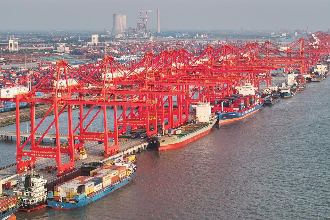 The aerial shows containers waiting to be transported at a port in Suzhou, in eastern China's Jiangsu province, on May 13, 2025. (AFP Photo)