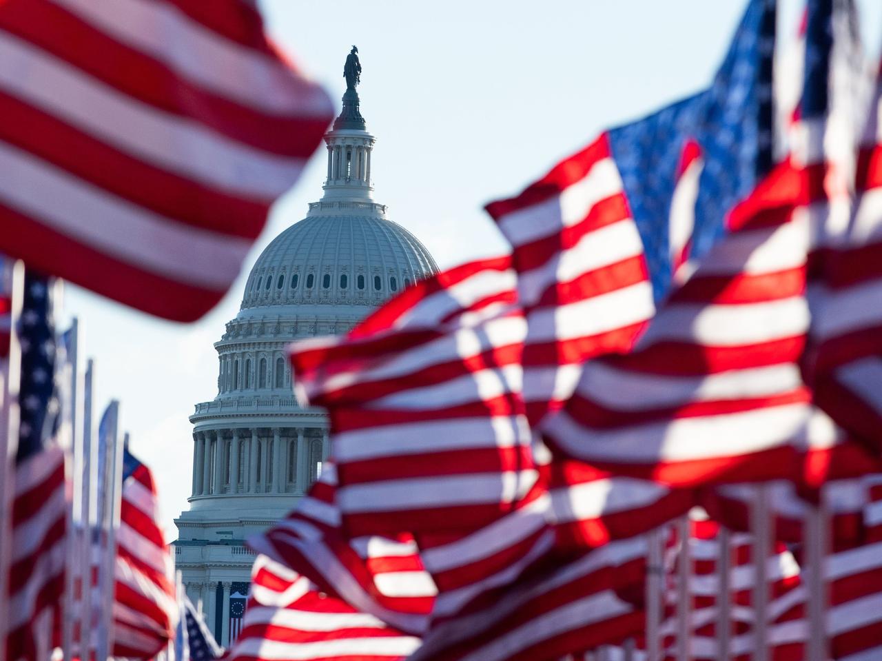  US flags representing those who could not attend the inauguration due to Covid-19, flutter in the wind at the Mall before the Inauguration of US President in Washington, DC on January 20, 2021. (AFP Photo)