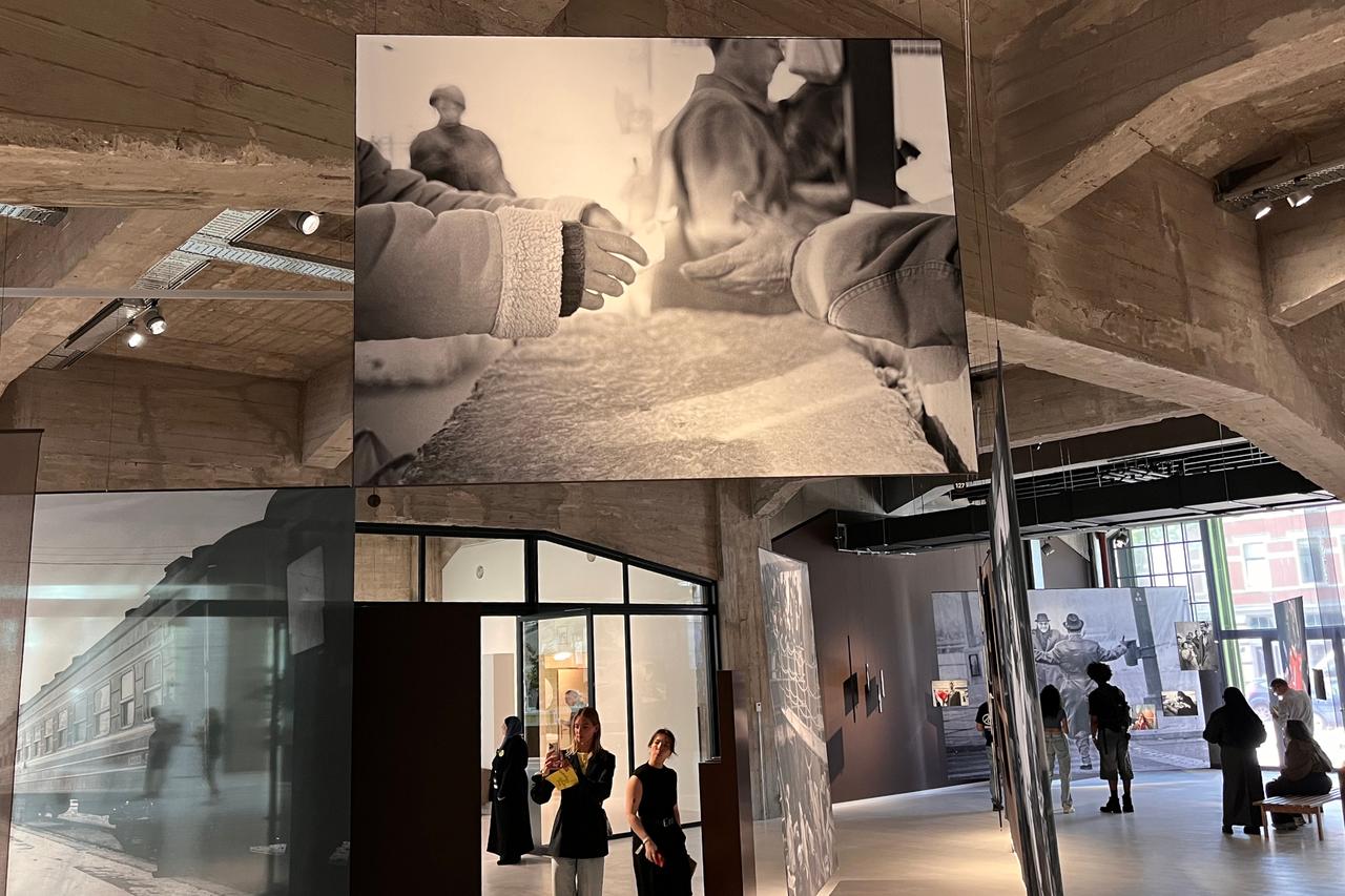 A photograph from Rula Halawani’s 2004 “Intimacy” series, taken at the Qalandia checkpoint in Palestine, depicts the daily restrictions of life under occupation, shown in the Family of Migrants exhibition at Fenix museum, Rotterdam, Netherlands, May 14, 2025. (Photo by Selin Hacialioglu/Türkiye Today)