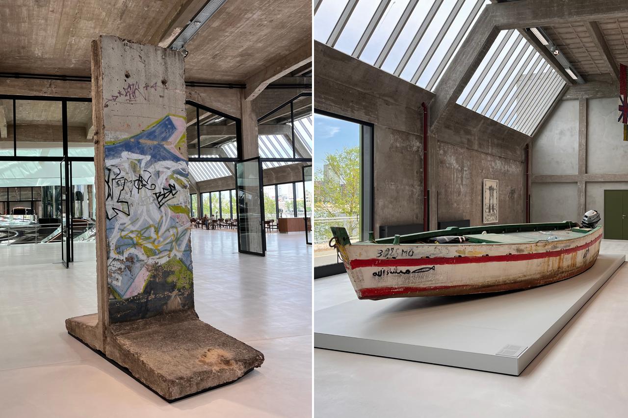 A fragment of the Berlin Wall and a migrant boat used to cross the Mediterranean are featured in the exhibition called All Directions at Fenix museum, Rotterdam, Netherlands, May 14, 2025. (Photo by Selin Hacialioglu/Türkiye Today)