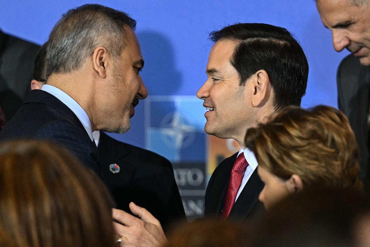 Foreign Minister Hakan Fidan (L) speaks with US Secretary of State Marco Rubio after a family picture during an informal meeting of The North Atlantic Treaty Organisation (NATO) foreign ministers ahead of potential peace talks between Ukraine and Russia in Türkiye's Antalya, on May 15, 2025. (AFP Photo)