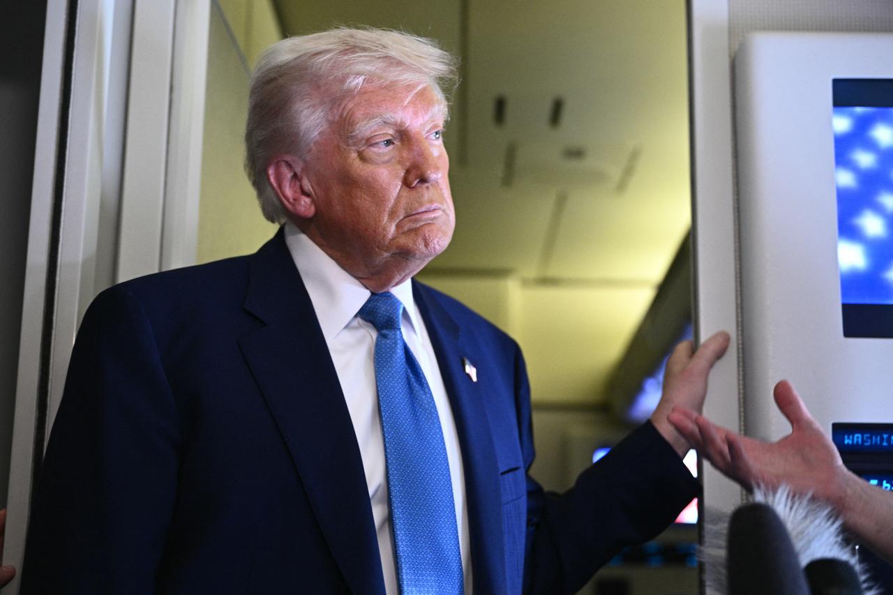 US President Donald Trump speaks to members of the media accompanying him aboard Airforce One, after leaving Abu Dhabi at the end of his Middle East tour on May 16, 2025. (AFP Photo)
