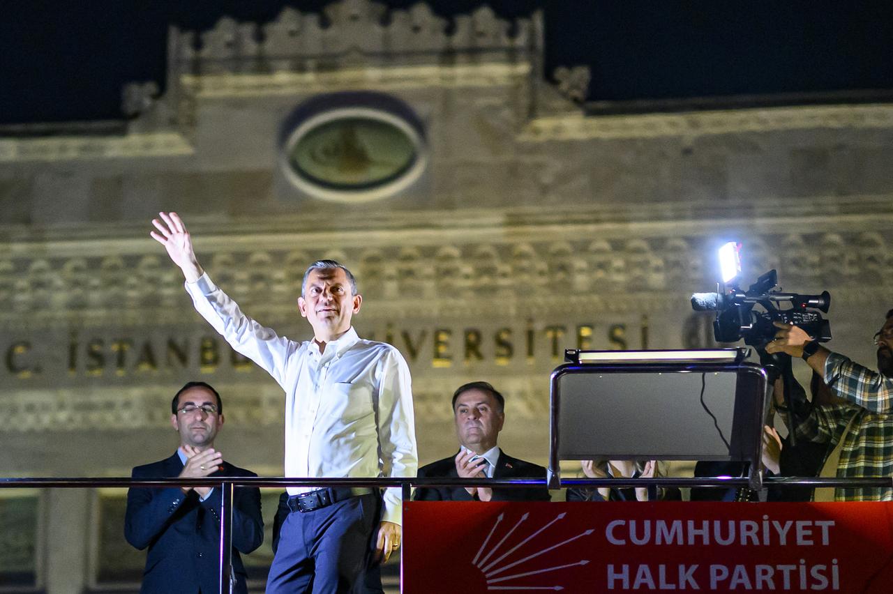 Leader of Türkiye's main opposition Republican People's Party (CHP) Ozgur Ozel (2L) waves as he attends a CHP rally against the detention of the Mayor of Istanbul, Ekrem Imamoglu, at Beyazid Square in Istanbul, 07 May 2025. (AFP Photo)