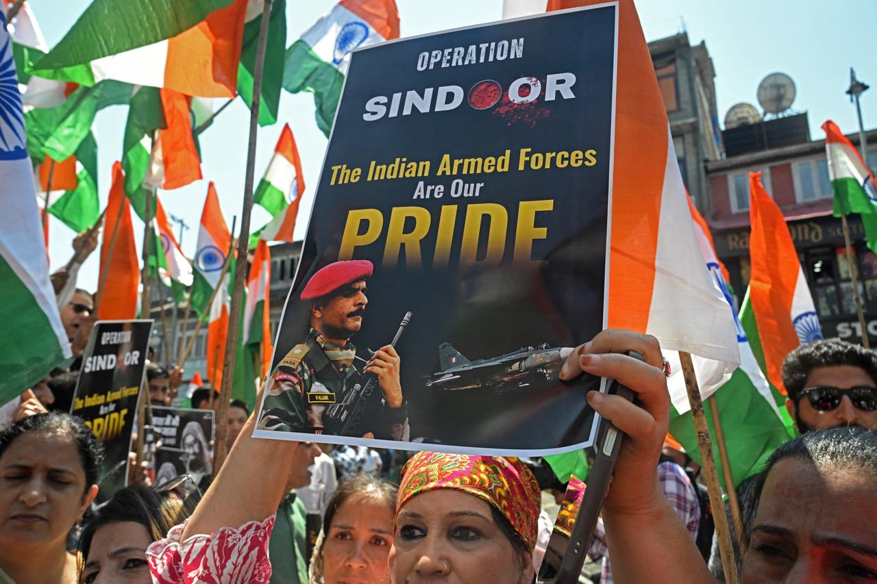 A supporter of Indias Bharatiya Janata Party (BJP) holds a placard during a rally expressing solidarity with the Indian armed forces, in Srinagar on May 15, 2025, following a ceasefire between Pakistan and India. (AFP Photo)