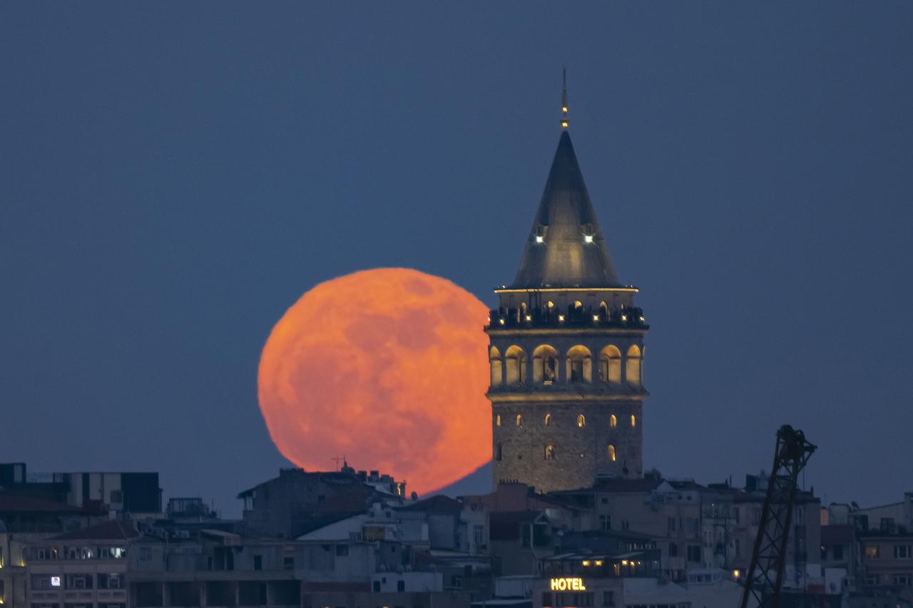 ISTANBUL, TURKIYE - MAY 12: Full moon rises behind Galata Tower in Istanbul, Turkiye on March 12, 2025. ( ?sa Terli - Anadolu Agency )