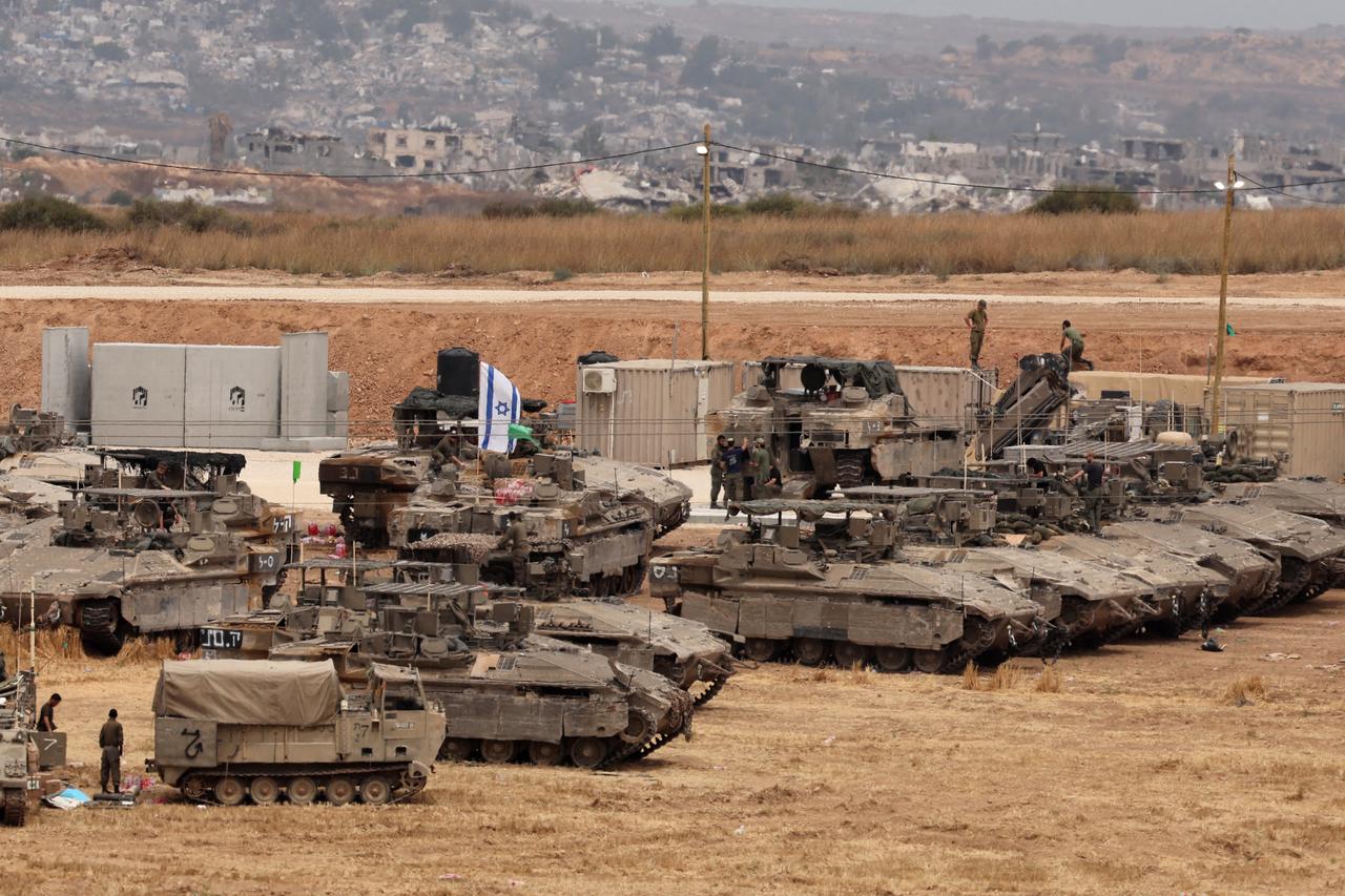 Israeli troops deploy on Israels border with the Gaza Strip amid the ongoing war between Israel and the Palestinian militant movement Hamas on May 15, 2025. Gaza rescuers said Israeli strikes and shelling on May 15 killed 82 people in the war-battered Palestinian territory, updating a previous toll. (Photo by Jack GUEZ / AFP)