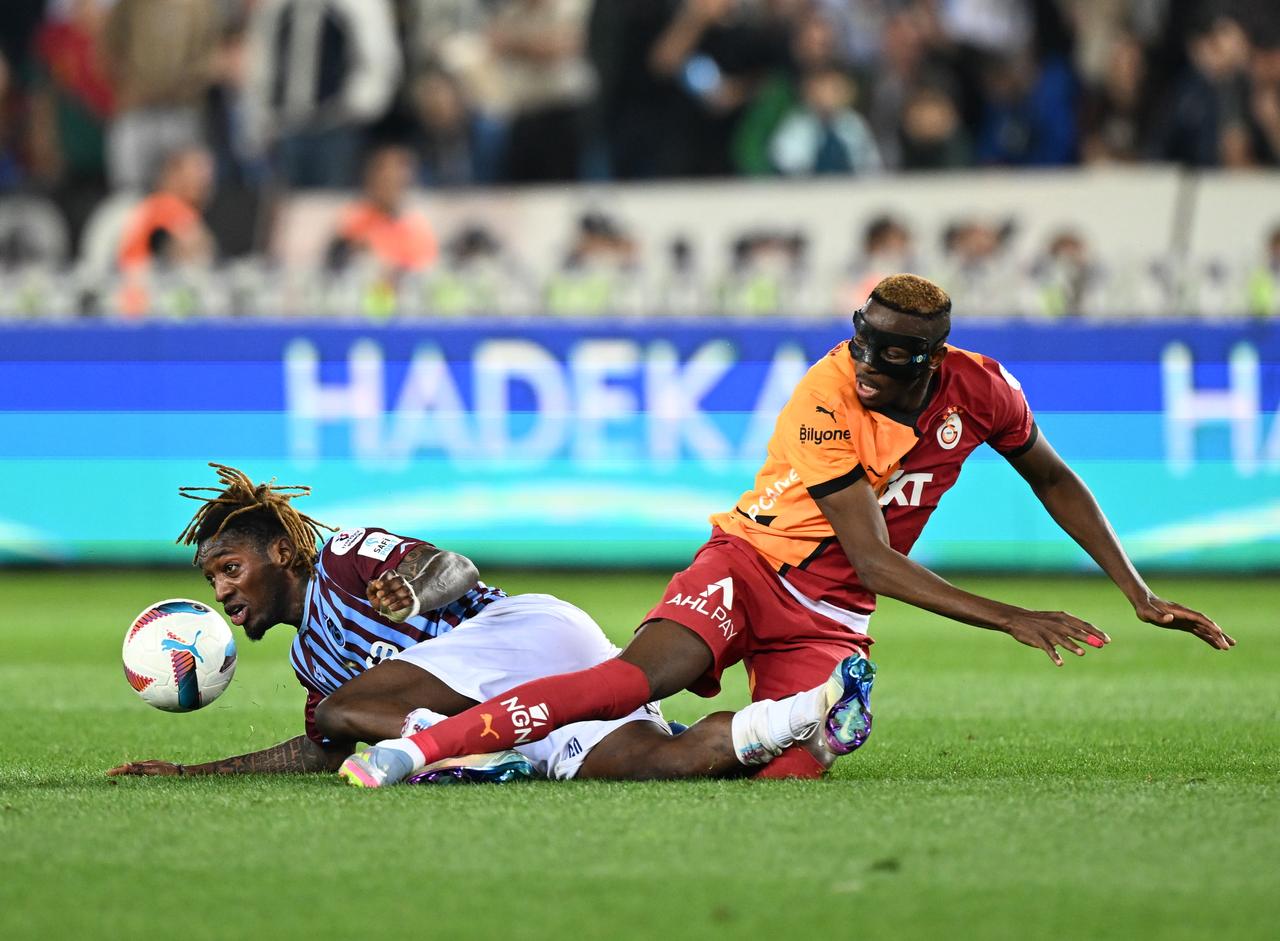 Victor Osimhen (R) of Galatasaray in action against Muhammed Cham (L) of Trabzonspor during Turkish Super Lig week 35 football match between Trabzonspor and Galatasaray at Papara Park in Trabzon, Turkiye on May 10, 2025. (AA Photo)