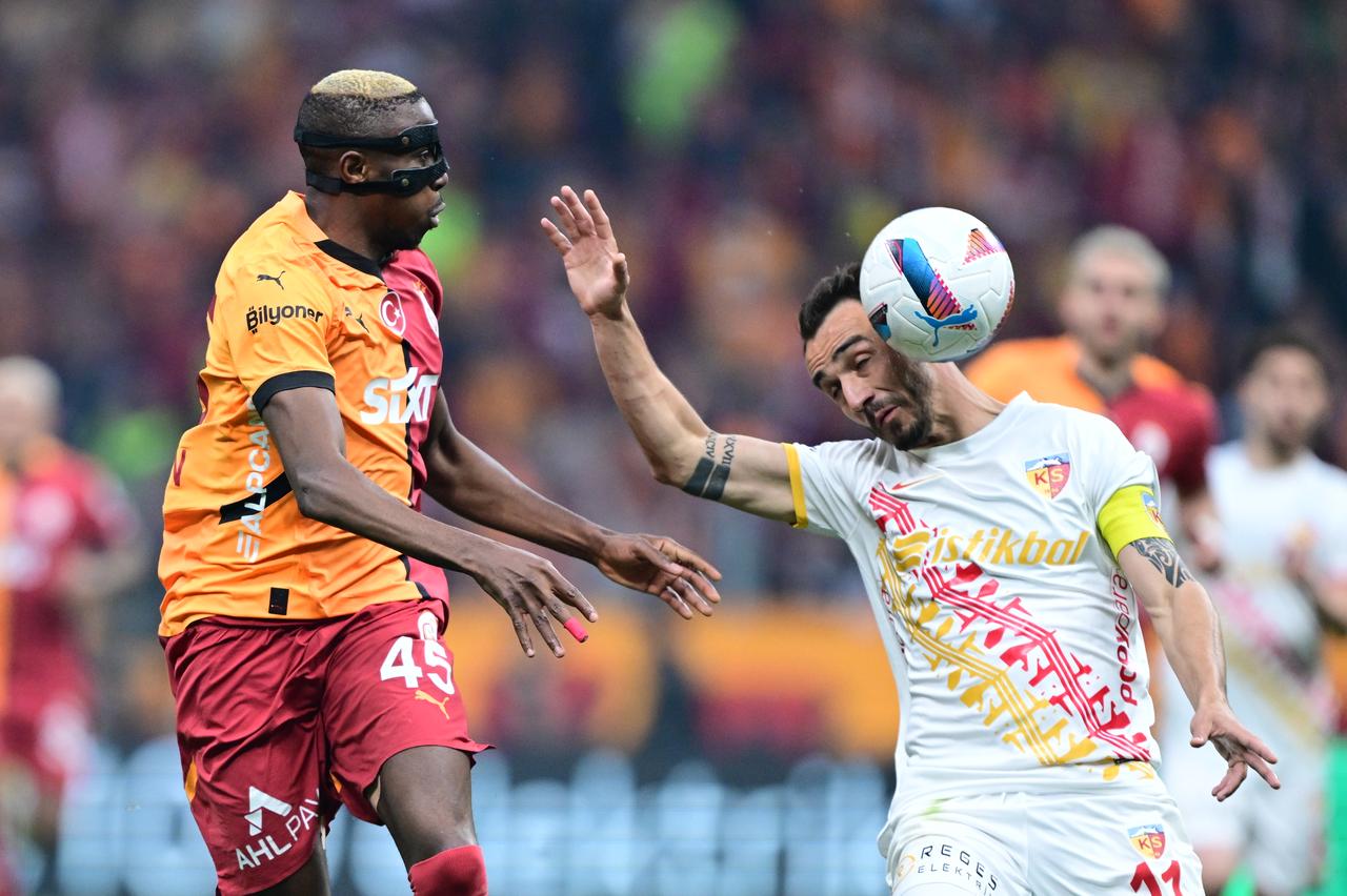 Victor Osimhen (45) of Galatasaray in action against Gokhan Sazdagi (R) of Bellona Kayserispor during the Turkish Super Lig week 36 football match between Galatasaray and Bellona Kayserispor at RAMS Park in Istanbul, Türkiye, on May 18, 2025. (AA Photo)