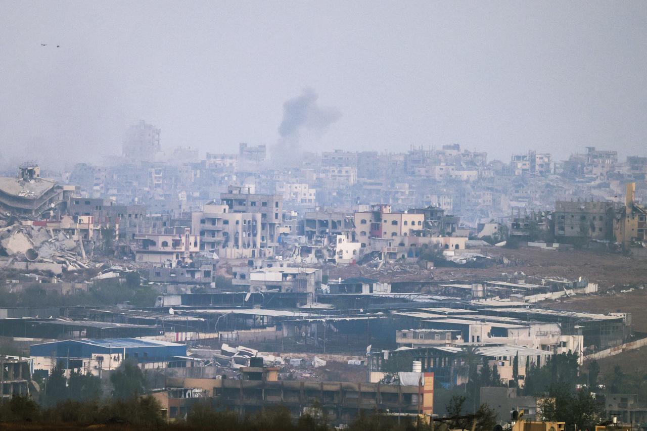 A picture taken from a position at the Israeli border with the Gaza Strip shows smoke billowing due to Israeli bombardment in the besieged Palestinian territory on May 18, 2025. Gazas civil defence agency said Israeli air strikes on May 18 killed at least 33 people, more than half of them children, a day after Israel announced an expanded military campaign. (Photo by Menahem KAHANA / AFP)