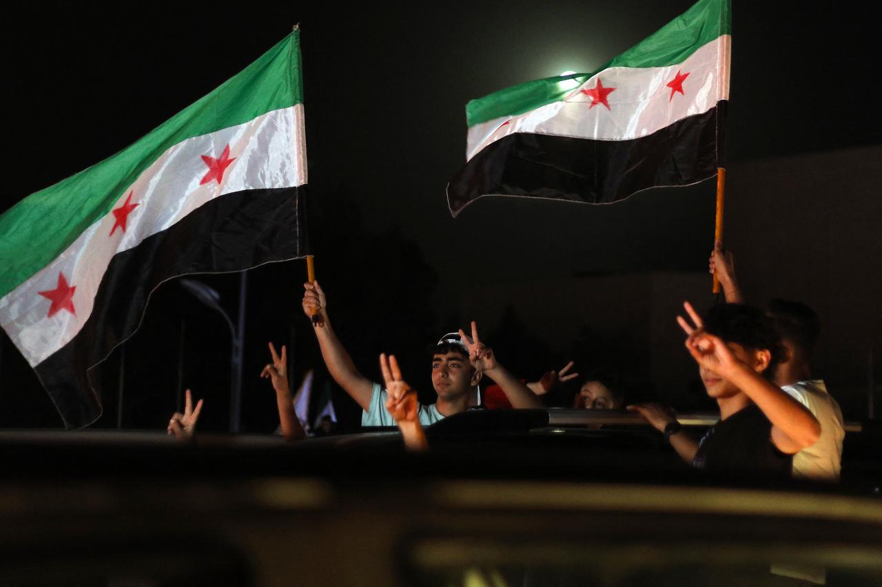 People celebrate in Damascus Omeyyad square after US President Donald Trumps decision to lift sanctions in Syria, on May 13, 2025. (AFP Photo)