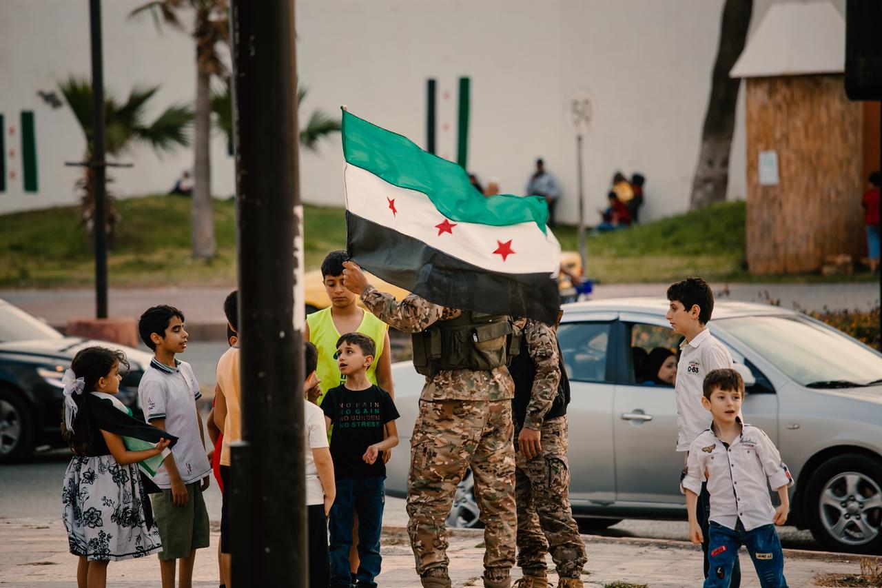 TARTUS, SYRIA - MAY 14: Syrians celebrate as the United States announces it will lift sanctions on the country in Tartus, Syria on May 14, 2025. In the western city of Tartus, crowds gathered to welcome the decision. U.S. President Donald Trump said he made the decision after consultations with Turkish President Recep Tayyip Erdogan and Saudi Crown Prince Mohammed bin Salman. ( Tamam Jerbi - Anadolu Agency )
