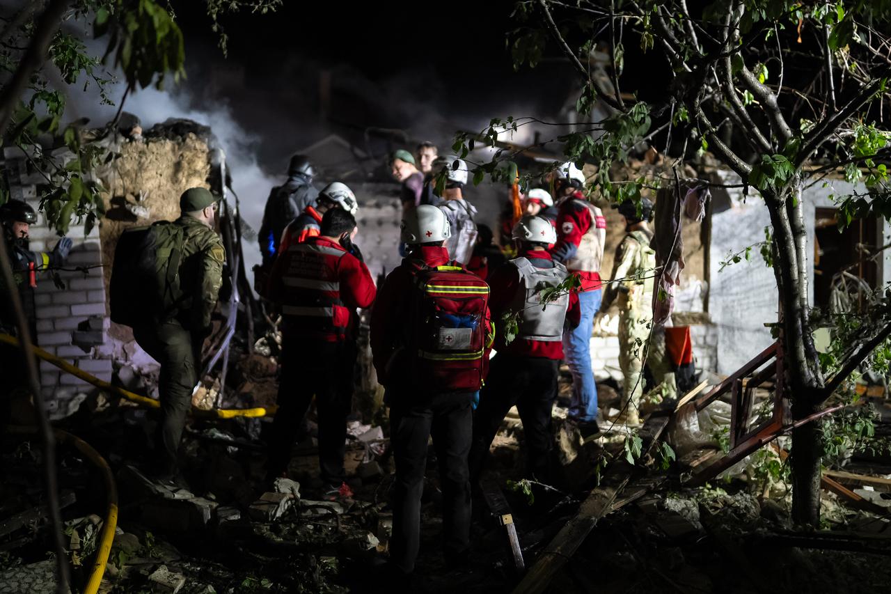 ZAPORIZHZHIA, UKRAINE - MAY 7: (----EDITORIAL USE ONLY - MANDATORY CREDIT - ZAPORIZHZHIA REGIONAL MILITARY ADMINISTRATION / HANDOUT - NO MARKETING NO ADVERTISING CAMPAIGNS - DISTRIBUTED AS A SERVICE TO CLIENTS----) Officials conduct a search operation in a damaged building as they inspect the aftermath of a recent Russian attack on Zaporizhzhia, Ukraine on May 7, 2025. At least 13 Shahed-type strike drones targeted residential areas and civilian infrastructure. The shelling caused damage to 15 apartment buildings and over 45 private homes across three districts. Energy infrastructure was also hit, and four civilians were injured. ( Zaporizhzhia Regional Military Adm. - Anadolu Agency )