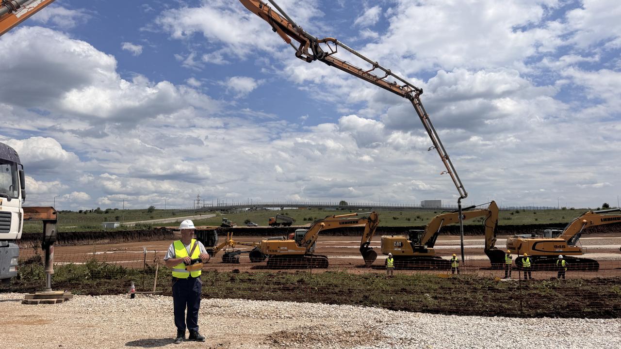 A construction worker stands in front of heavy machinery during the groundbreaking ceremony for the new Sahterm factory in Skopje, North Macedonia, on May 17, 2025. (AA Photo)